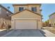 Charming tan two-story home featuring a spacious two-car garage and tile roofing at 5329 Fireside Ranch Ave, Las Vegas, NV 89131