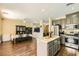 Open-concept kitchen and dining area featuring modern appliances and stylish decor at 5329 Fireside Ranch Ave, Las Vegas, NV 89131