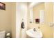 This powder room features a vessel sink, mirror, and neutral wall color at 5329 Fireside Ranch Ave, Las Vegas, NV 89131