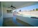 Comfortable covered backyard patio overlooking the pool and backyard at 5732 Heron Ave, Las Vegas, NV 89107