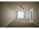 Spacious bedroom featuring neutral carpet and a sliding glass door for lots of natural light at 5732 Heron Ave, Las Vegas, NV 89107