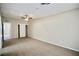 A spacious carpeted bedroom with access to both a closet and attached bathroom at 5732 Heron Ave, Las Vegas, NV 89107