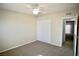 Cozy bedroom featuring neutral walls, a ceiling fan, carpeted floor, and a closet at 5732 Heron Ave, Las Vegas, NV 89107