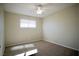 Bright, carpeted bedroom with natural light from the window at 5732 Heron Ave, Las Vegas, NV 89107