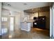 Kitchen with stainless steel appliances, island, and dining area; great for entertaining guests and Gathering at 5732 Heron Ave, Las Vegas, NV 89107