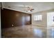 Inviting living room with eye catching feature wall and sleek tile floors at 5732 Heron Ave, Las Vegas, NV 89107