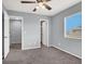 Bedroom with a ceiling fan, grey carpet, a large window, and easy access to other rooms at 584 Sellers Pl, Henderson, NV 89011