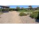 Gravel walking path in community area featuring covered gazebos and desert landscaping at 584 Sellers Pl, Henderson, NV 89011