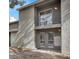 Apartment exterior shows private balcony, gray stucco, and rock landscaping, creating a modern desert aesthetic at 584 Sellers Pl, Henderson, NV 89011