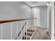 Upstairs hallway featuring neutral carpet, gray walls, and a white door for a clean and bright aesthetic at 584 Sellers Pl, Henderson, NV 89011