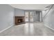 Living room featuring a fireplace, large windows and access to the upper level staircase at 584 Sellers Pl, Henderson, NV 89011