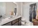 Bathroom featuring a vanity with ample counter space and a shower-tub combination at 6016 La Coste St, North Las Vegas, NV 89081