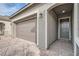 Close-up of the front entrance with a brick driveway and arched entryway at 6016 La Coste St, North Las Vegas, NV 89081