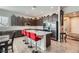 Modern kitchen featuring a center island with seating and stainless steel appliances at 6016 La Coste St, North Las Vegas, NV 89081