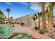 Resort style backyard features a custom pool, mature landscaping, a putting green, and mountain views at 6105 Port Of Dreams Dr, Las Vegas, NV 89130