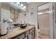 Bathroom featuring a vessel sink, granite countertop and framed mirror at 6105 Port Of Dreams Dr, Las Vegas, NV 89130