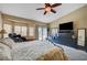 Bright bedroom featuring a bay window, dresser, and modern black furniture at 6105 Port Of Dreams Dr, Las Vegas, NV 89130