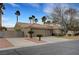 Beautiful home boasting a large driveway, lush landscaping, a terracotta-tiled roof, and an attached three-car garage at 6105 Port Of Dreams Dr, Las Vegas, NV 89130