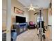 A gym area featuring a ceiling fan, television, and assorted workout equipment at 6105 Port Of Dreams Dr, Las Vegas, NV 89130