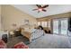 Main bedroom featuring plush carpet, vaulted ceilings, and pool access at 6105 Port Of Dreams Dr, Las Vegas, NV 89130