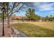 Community park featuring mature trees, green grass, benches and walking trails at 6105 Port Of Dreams Dr, Las Vegas, NV 89130