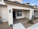 Inviting covered front porch with brick pavers and stylish exterior lighting at 6154 Rathbone St, Las Vegas, NV 89166