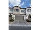 Exterior shot of garage with neutral paint and a beautiful brick paver driveway at 6154 Rathbone St, Las Vegas, NV 89166