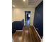 Upstairs hallway with dark wood floors and modern wall paint at 6154 Rathbone St, Las Vegas, NV 89166