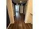 Upstairs hallway with dark wood floors and modern wall paint at 6154 Rathbone St, Las Vegas, NV 89166