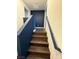 Carpeted staircase with dark wood flooring at 6154 Rathbone St, Las Vegas, NV 89166