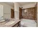 Bathroom featuring a tub and shower combo, a single sink vanity, and neutral color tones at 6250 Sierra Knolls Ct, Las Vegas, NV 89139