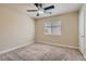 Bedroom featuring neutral carpet, ceiling fan, and a window with natural light at 6250 Sierra Knolls Ct, Las Vegas, NV 89139