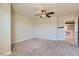 Neutral bedroom features include plush carpet, ceiling fan, and ensuite bathroom entrance at 6250 Sierra Knolls Ct, Las Vegas, NV 89139