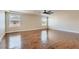 Large bedroom with hardwood floors, a ceiling fan, and two sunny windows at 6250 Sierra Knolls Ct, Las Vegas, NV 89139