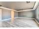 Large bonus room featuring neutral walls, laminate flooring, and a ceiling-mounted projector at 6250 Sierra Knolls Ct, Las Vegas, NV 89139