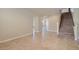 Hallway with tile flooring leading to carpeted staircase at 6250 Sierra Knolls Ct, Las Vegas, NV 89139