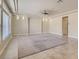 Bright living room featuring tile floors, neutral walls, and a modern ceiling fan at 6250 Sierra Knolls Ct, Las Vegas, NV 89139