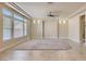 Bright living room with tile floors, neutral walls, and many windows letting in natural light at 6250 Sierra Knolls Ct, Las Vegas, NV 89139