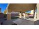 Covered patio with brick pillars overlooks the turf at 6250 Sierra Knolls Ct, Las Vegas, NV 89139