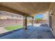 Covered patio with brick pillars, landscaping and turf at 6250 Sierra Knolls Ct, Las Vegas, NV 89139