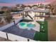 Aerial view of a home's backyard, highlighting the pool, patio, and landscaping at 6885 Stone Dr, Las Vegas, NV 89110