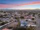 Aerial view of a modern home with a large backyard and distant city views at 6885 Stone Dr, Las Vegas, NV 89110