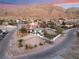 Aerial perspective of a contemporary home with a spacious lot and mountain backdrop at 6885 Stone Dr, Las Vegas, NV 89110