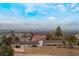 Stunning aerial view of a modern home with a pool, offering breathtaking mountain views at 6885 Stone Dr, Las Vegas, NV 89110