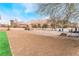 Landscaped backyard with gravel and artificial turf next to a modern home at 6885 Stone Dr, Las Vegas, NV 89110