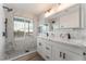 Bathroom with double vanity and marble shower at 6885 Stone Dr, Las Vegas, NV 89110