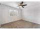 Bright bedroom with ceiling fan and carpet at 6885 Stone Dr, Las Vegas, NV 89110