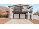 Two-story home with a modern design, two-car garage, and mountain views at 6885 Stone Dr, Las Vegas, NV 89110