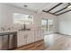 Kitchen with modern sink, white cabinets, and a view at 6885 Stone Dr, Las Vegas, NV 89110