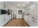 Modern kitchen with white cabinets and quartz countertops at 6885 Stone Dr, Las Vegas, NV 89110